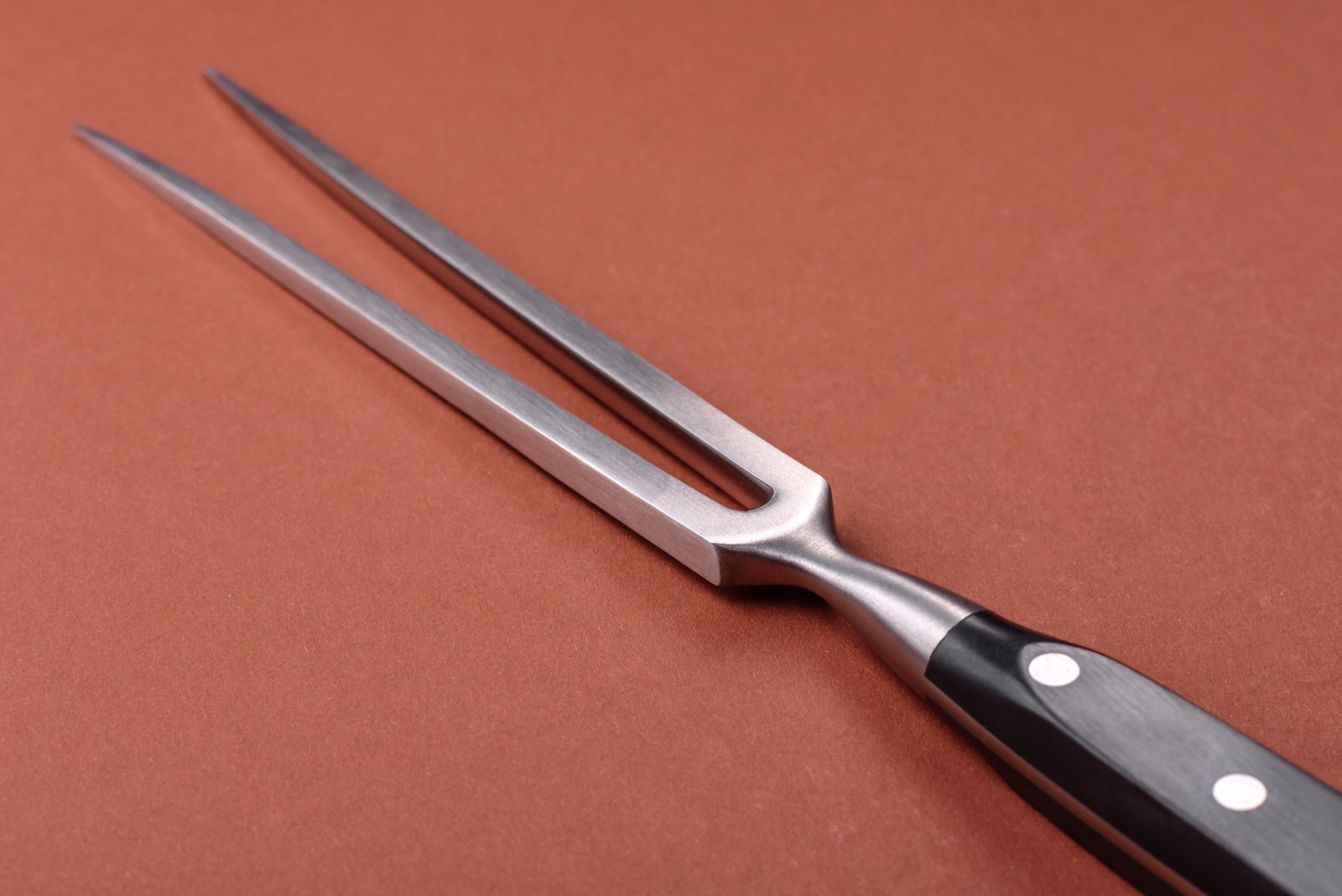 A two-pronged carving fork - sadly not a trident
