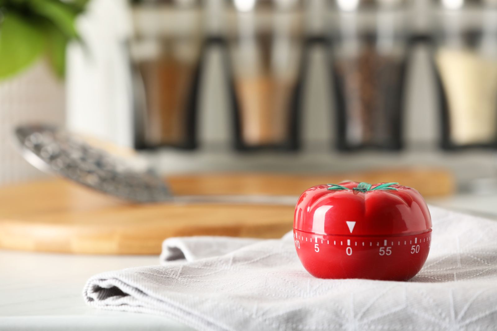 A tomato timer on a kitchen counter